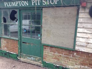 Derelict Plumpton Pit Stop with boarded window